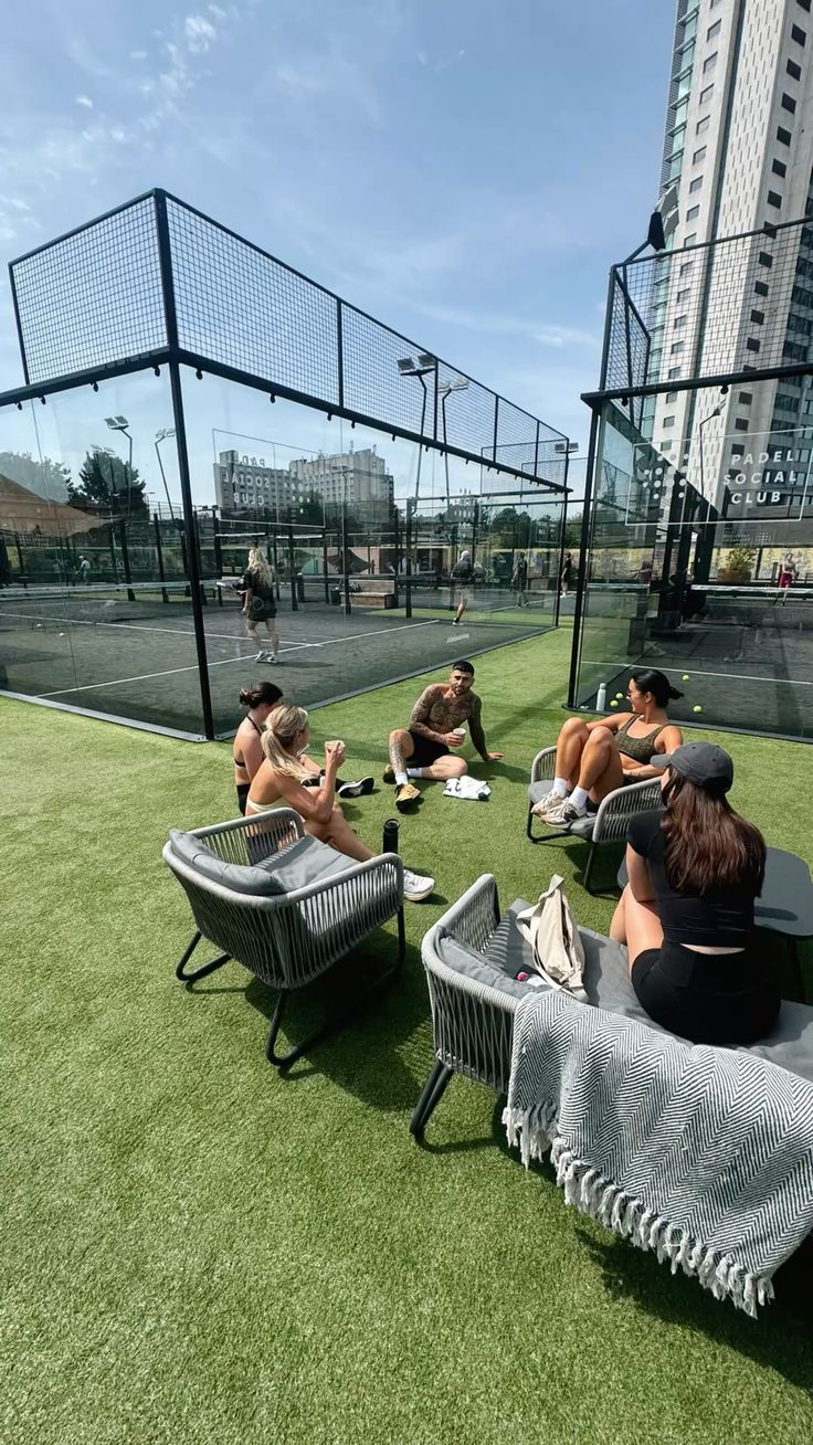 Group of padel players at a modern outdoor padel court in Doha, Qatar, representing padel lifestyle and community